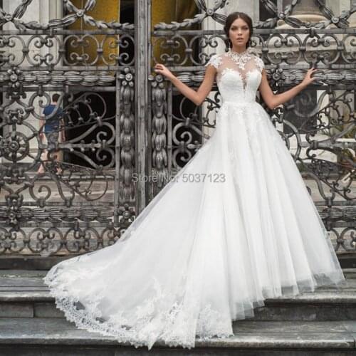 Elegant High NeckWedding Dresses A Line Cap Slee Lace Appliques Button Illusion Bridal Wedding Gown Court Train Vestido De Noiva