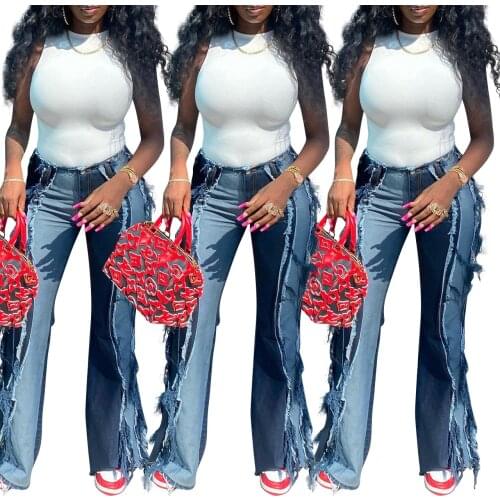 2021 Trend Autumn New Style Ripped Hole Personality Denim Raw Edge Stitching Jeans (Trousers Only)