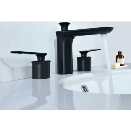 Tape of the black faucet of the polished bronze basin mounted faucet of the bathroom faucet three double hole handles hot and