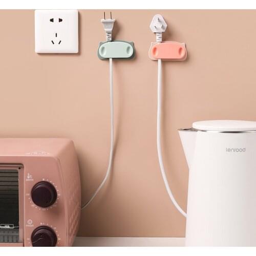 Creative power cord plug hook punch-free hanging kitchen socket to hold fixed power plug fixer nail-free