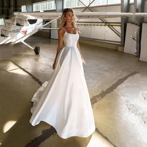 UZN Boho A-LINE Wedding Dress Backless Spagetti Straps Beading Bridal Gowns Russia Elegant Simple Satin Brides Dress Custom Made