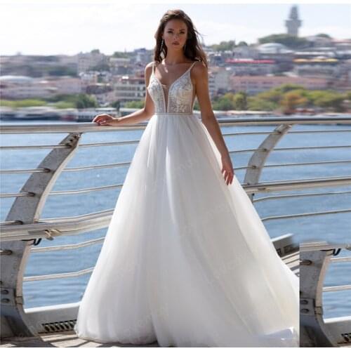 2021 Sequined Beach Wedding Dresses Beaded Lace Appliques Sexy Deep V Neck Sleeveless Backless Sweep Train Boho Bridal Gown