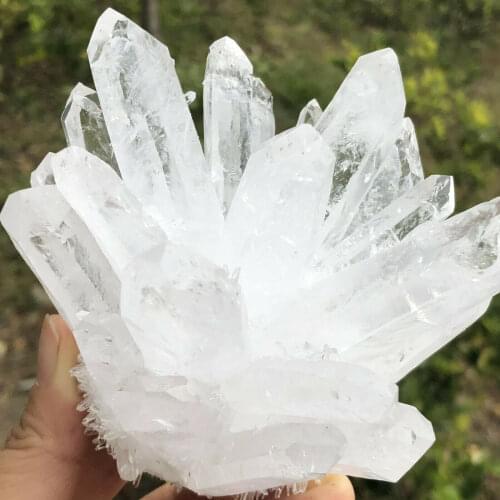 A mineral specimen of naturally healing clear white quartz crystal clusters