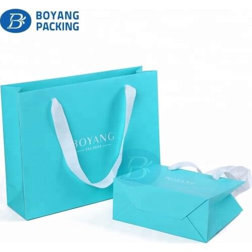 Luxury matte logo blue shopping fancy paper gift bag for clothing packaging