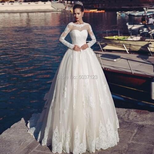 2021 A Line Wedding Dresses Tulle Long Sleeves O Neck Lace Appliques Backless Robe De Mariée Bridal Gown Vestido De Noiva