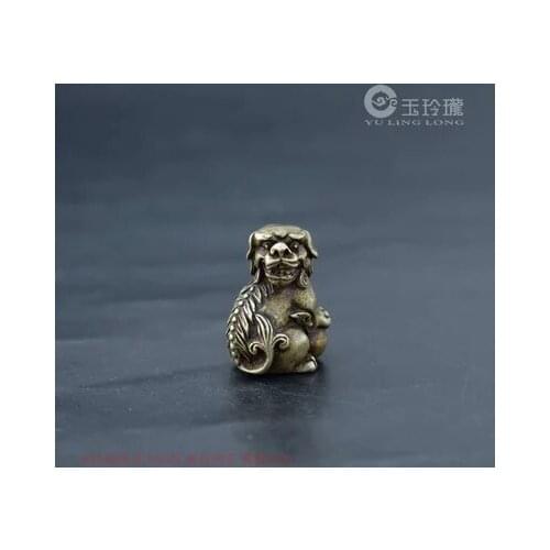 Copper lion holding the ball ornament