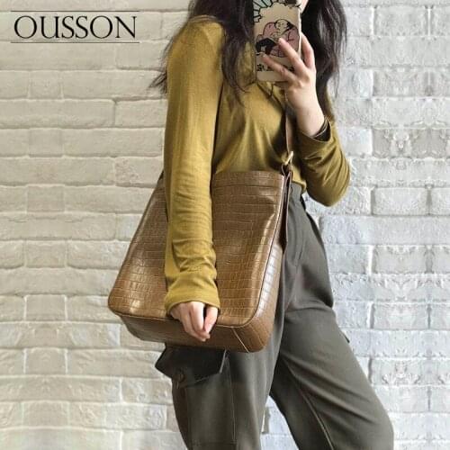 OUSSON Fashion, leisure, light and versatile one-shoulder messenger portable first layer cowhide large capacity bucket bag