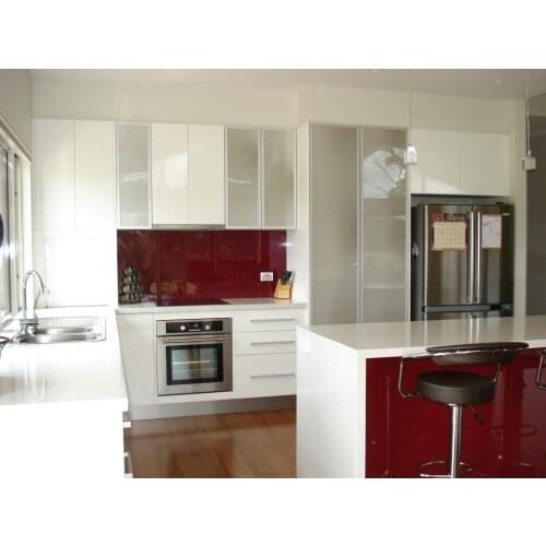 Modern kitchen furniture with red kitchen backsplash