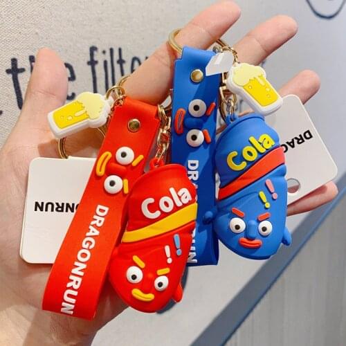 2020 Creative Cute Cola Bottle Rocking Toy Doll Cartoon Car Keychain Pendant Male and Female Bag Key Chain Jewelry Funny Gift