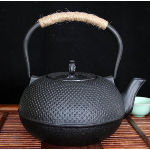 Free shipping big size special 0.9L granule black iron teapots, hotsaleStainless steel infuser no coating cast iron teaset