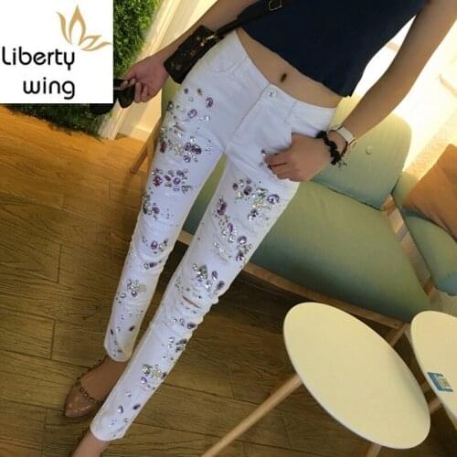 Spring New Embroidered Flares Jeans Woman Fashionable White Hole Ripped Stretch Pencil Pants Diamond Casual Denim Trouser Female