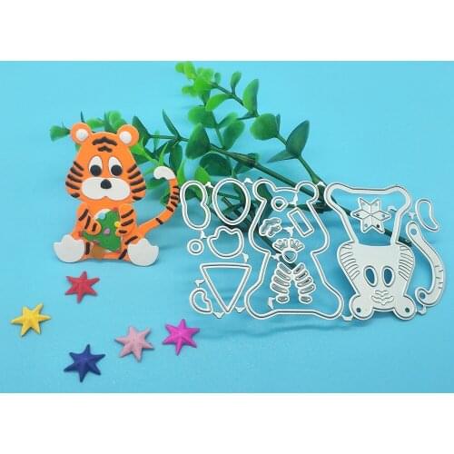 Tiger cutting template holding Christmas tree for metal cutting of DIY scrapbook, used for card making, embossing crafts