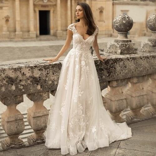 Fashion Floor Length Tulle Wedding Dress 2021 Sexy Deep V-Neck Cap Sleeve Lace Appliques Sweep Train Button Back Bridal Gowns