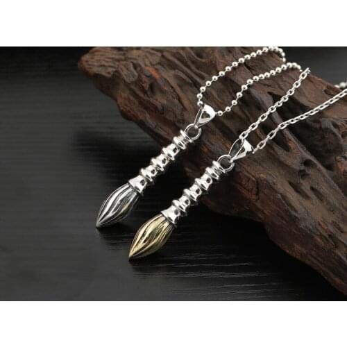 990 silver and gold list title brush pendant