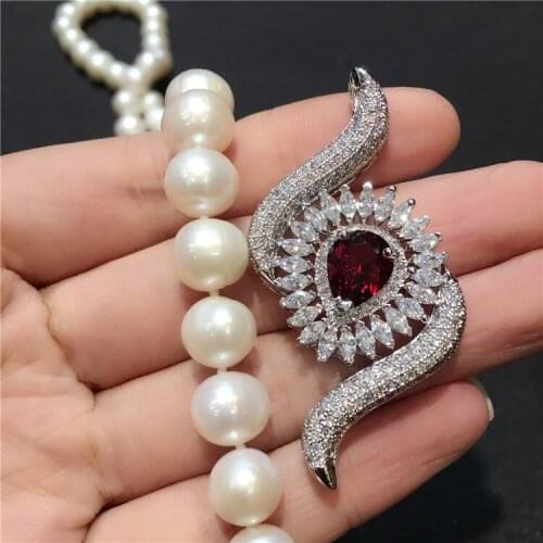 High-grade zircon micro inlay beautiful eyes buckle tassel pendant fashion long sweater chain link clasp