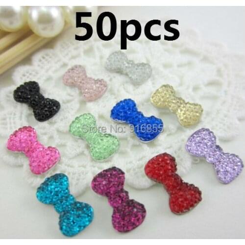 Free shipping new and fashion 50pcs/lot 12.5*7mm bow shape flatback resin rhinestone,resin cartoon for DIY decoration