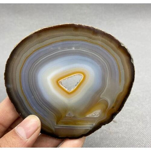 Natural agate slice polished ore specimen with crystal hole