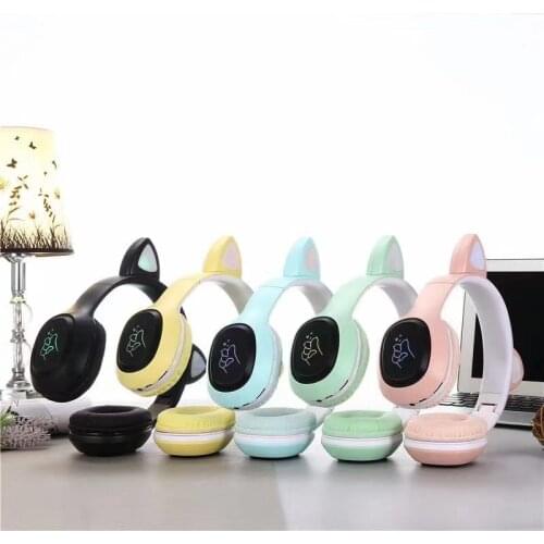 The new web celebrity students cute cat ears wireless Macaron-color Bluetooth headset can plug in TF card game headphones