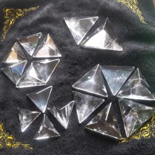 Natural white crystal triangle pyramid.Crystalline energy points are used for reiki healing