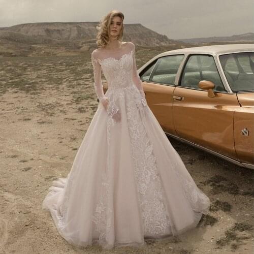 Gorgeous Long Sleeve Wedding Dresses 2021 A-Line Sheer Scoop Neck Lace Appliques Blackless Tulle Bridal Gown With Pocket