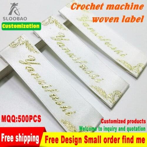 ClothingTagsCustomWoodenShuttleMachineWovenLabelsWashableGarmentLabelsWithMetalYarnLogoOnWhiteBackgroundClothingCabelsClothing
