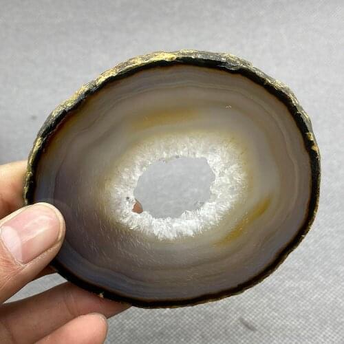Natural agate slice polished ore specimen with crystal hole