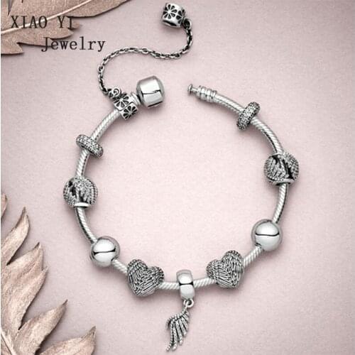 XIAOYI jewelry 100% s925 11 charm love angel feather hang DIY original charm bracelet jewelry gentle