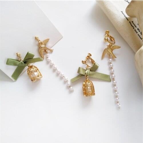 RUANME asymmetry of a pair of bow earring han edition women pearl earrings small cage no ear pierced ear clip long pearl earring