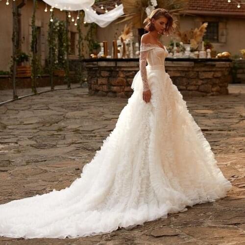 2021 New Cap Long Sleeves Ball Gown Tulle Wedding Dresses Lace See Through Ruffled Long Train Bridal Wedding Gowns
