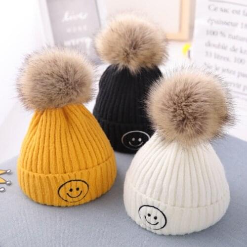 Autumn and winter baby cute smiling face warm woolen cap, childrens Korean casual knitted cap Thickened warm hasual knitted cap