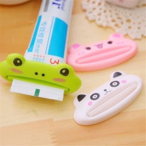 1 PC Arrival Cute Creative Cartoon Bathroom Tube Rolling Holder Easy Squeezer Toothpaste Dispenser