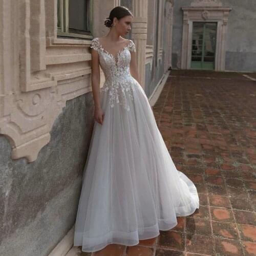 YIWUMENSA Chaming Short Sleeves Beach Wedding Dress Plus Size Sexy Backless Lace Appliues Princess Bridal Gowns Plus Size