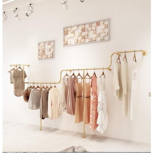 A shelf on which clothes are sold in a womens clothing store