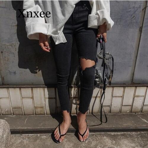 Black long pants hole Korean version of the small feet tight stretch nine pants pants knees irregular fuzzy black hole jeans
