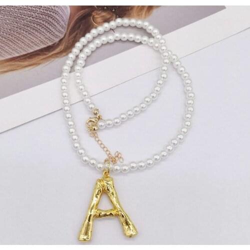 New Korean version of the wind network red star with the letter M pearl necklace Beautiful temperament letter necklace 631