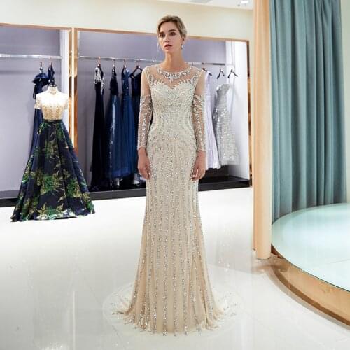 2020 Luxury Evening Dresses Sheer Crystal Beaded Long Sleeves Women Trumpet Champagne Long Party Gown