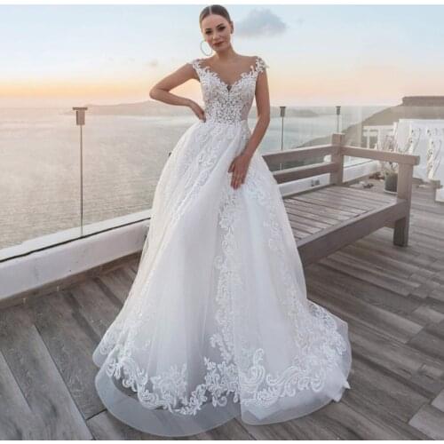 A-Line Tulle Wedding Dresses 2021 Cap Sleeve Sheer O-Neck Gorgeous Lace Bridal Gown With Button Back Sweep Train Custom Made