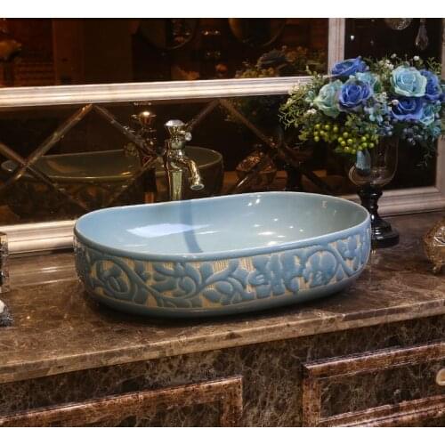 Pale blue oval carved art washbasin Oval ceramic washbasin bathroom washbasin
