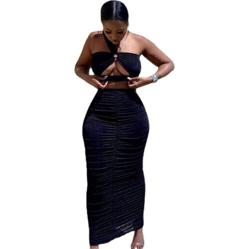 A nightclub party body suit with a tight cut and a crinkled jacket and a long skirt