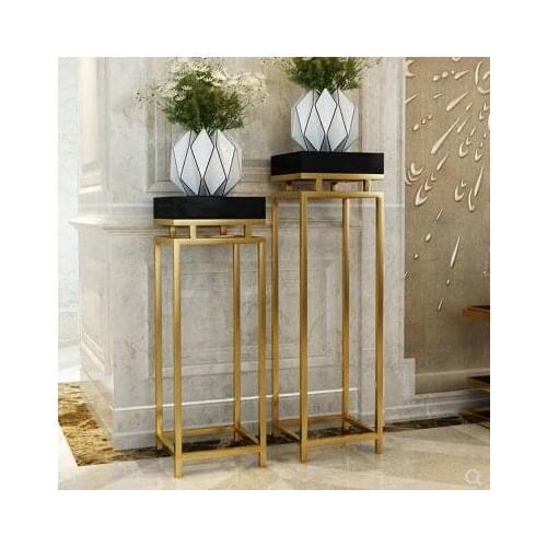Classic stainless steel gilt rack. Modern living room decorated with plant flower stand