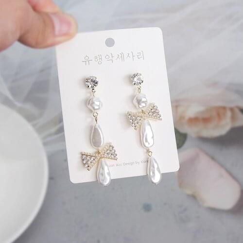 MWSONYA Fashion Korean Exquisite Shell Pearl Bowknot Dangle Earrings for Women Asymmetrical Drop Earrings Temperament Jewelry