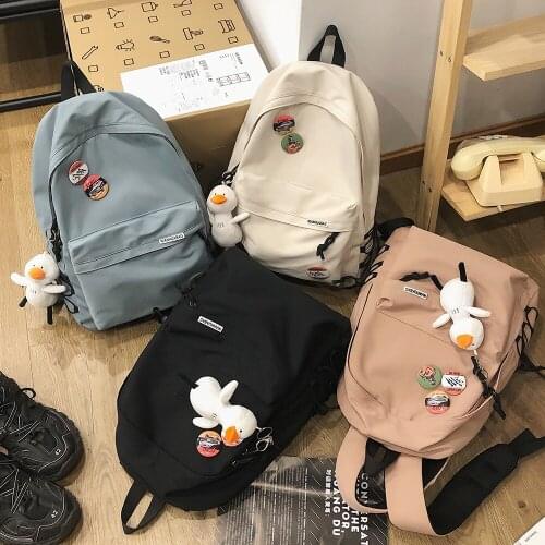 Fashion Womens Backpack Solid Color Nylon Waterproof School Bags For Girls Cute Pendant Large Capacity Travel Bag 2021 Mochila