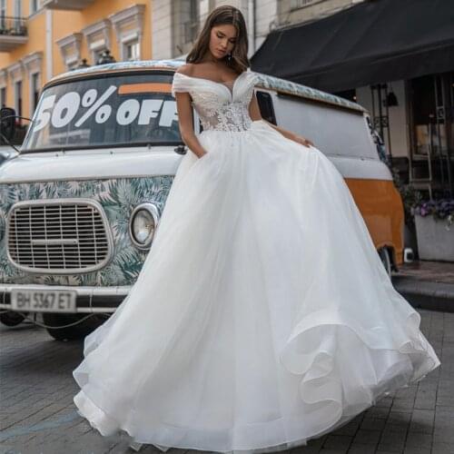 Eightree White Princess Wedding Dresses 2021 Off Shoulder Appliques Bridal Dress A-Line Tulle Beach Wedding Ball Gown Plus Size