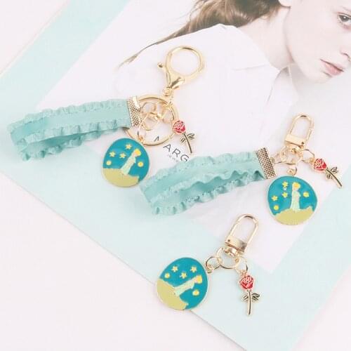 Cute Cartoon Little Prince Keychain Alloy Rose Blue Lace Ribbon Keychain Female Men Bag Car Pendant Ornament Key Ring Gift