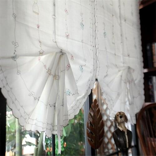 Lazy eye Roman Blinds On The Windows