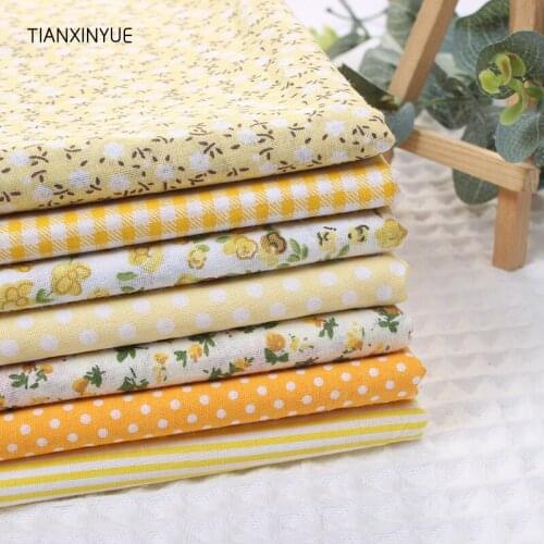 TIANXINYUE 7 pcs/lot Yellow color 100% Cotton Fabric for Sewing Patchwork Kids Bags Baby toy DIY flower dot Fabric