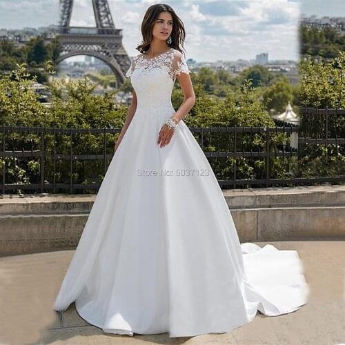 Charming A Line Satin Wedding Dresses Nude Tulle Neckline with Ivory Appliques Short Sleeve Buttons Back Bridal Gown Sweep Train