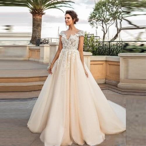 Sheer O-neck Cap Sleeve Illusion Back A-line Wedding Gowns Flower Appliqued Lace Crystals Wedding Dresses 2020 robe de mariee