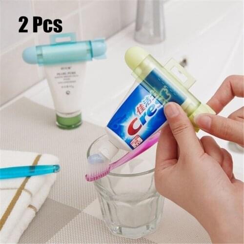 2PCS ABS Cute Rolling Squeezer Toothpaste Dispenser Tube Partner Hanging Holder