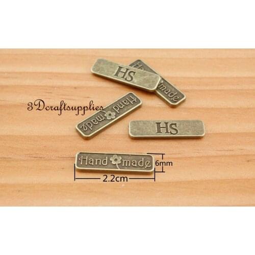 Metal label tag HANDMADE charm alloying anti brass 22 mm x 6 mm 50 pieces H67